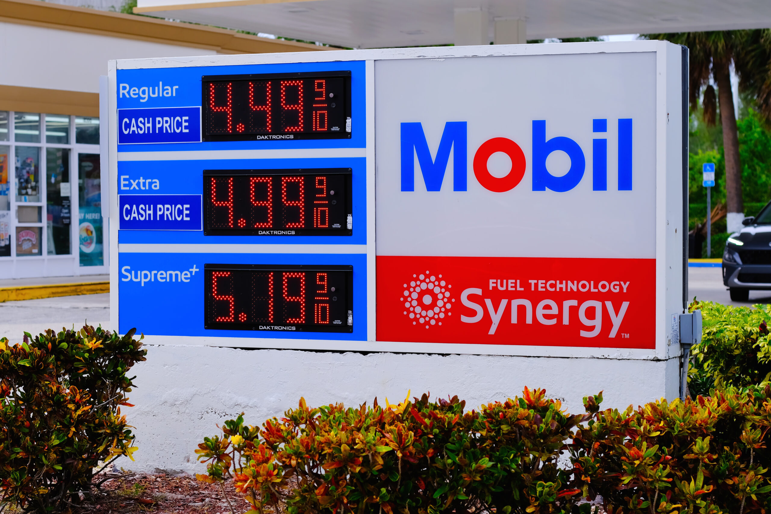 Sunny Isles Beach, FL, USA – August 04, 2024: Mobil gas station sign displays fuel prices.